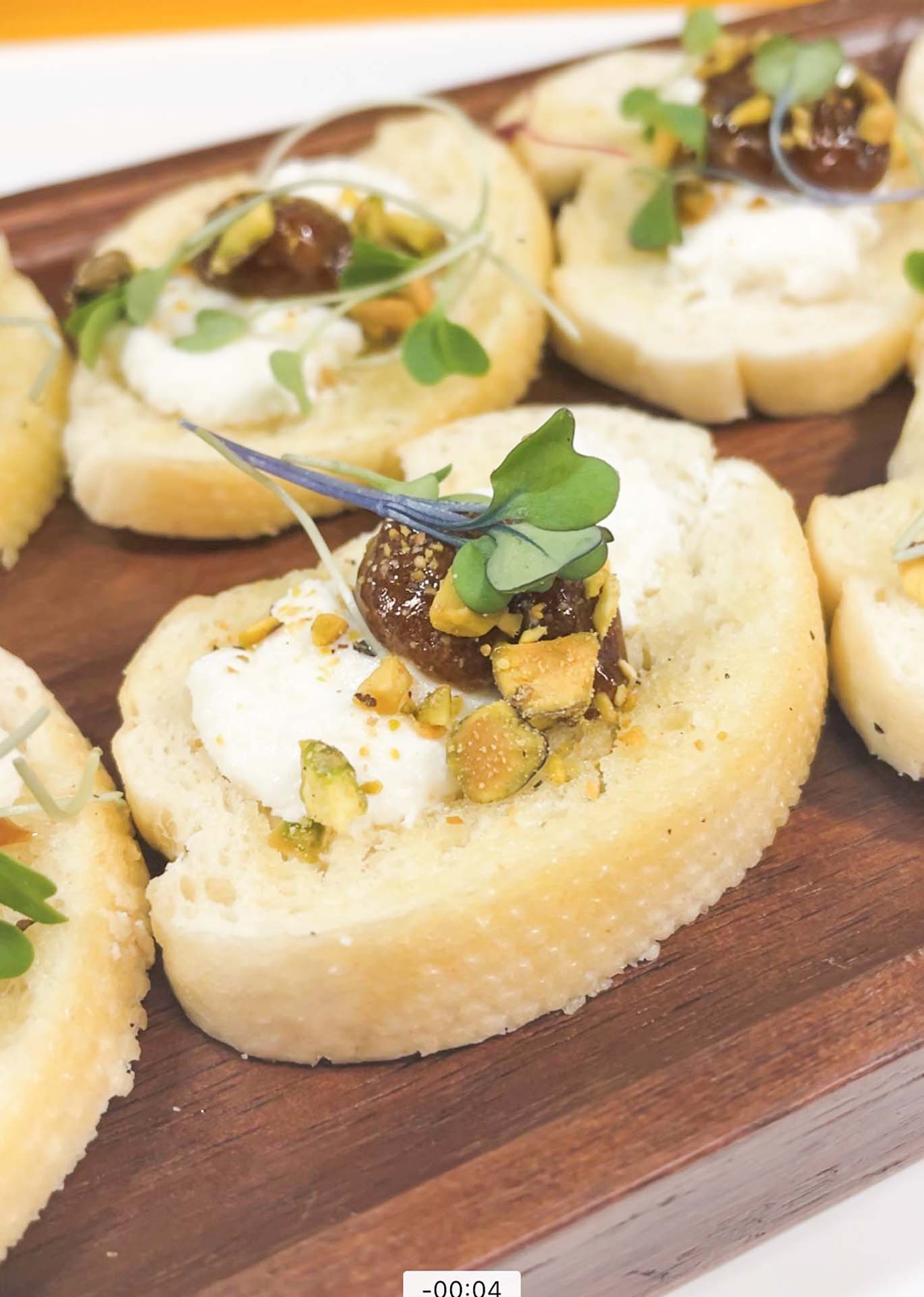GOAT CHEESE AND PISTACHIO CROSTINI WITH FIG JAM